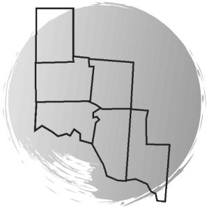 Outline of four adjacent U.S. states—New Mexico, Texas, Oklahoma, and Colorado—on a gray circular background.