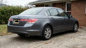 Honda Accord sedan parked in residential driveway with Ohio license plate